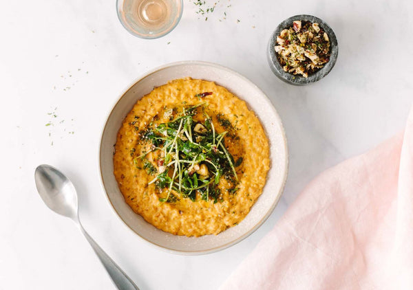 Sunflower carrot risotto with hazelnut-pea shoots